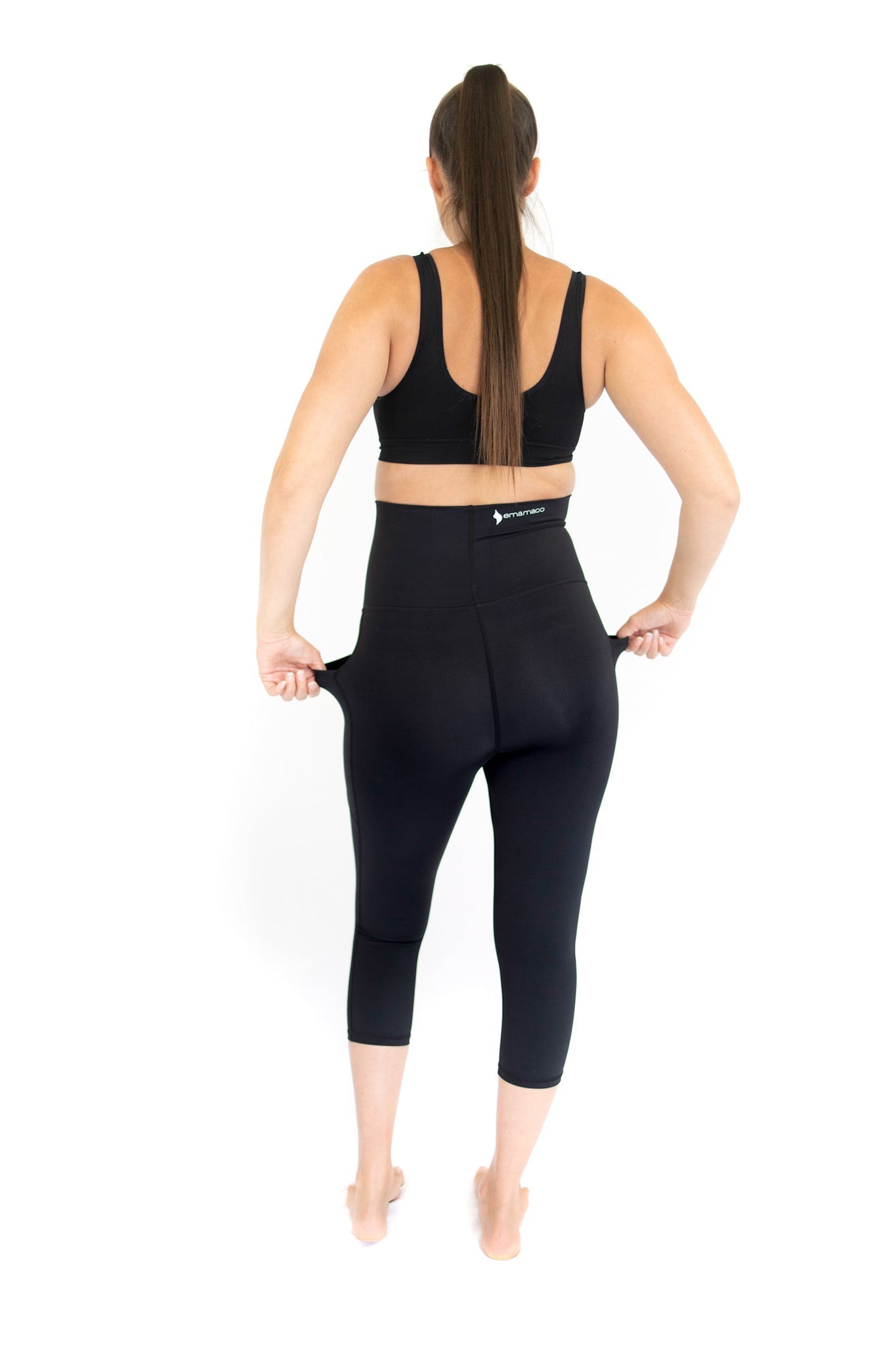 Woman in black maternity leggings with pockets, showcasing completely specialised design