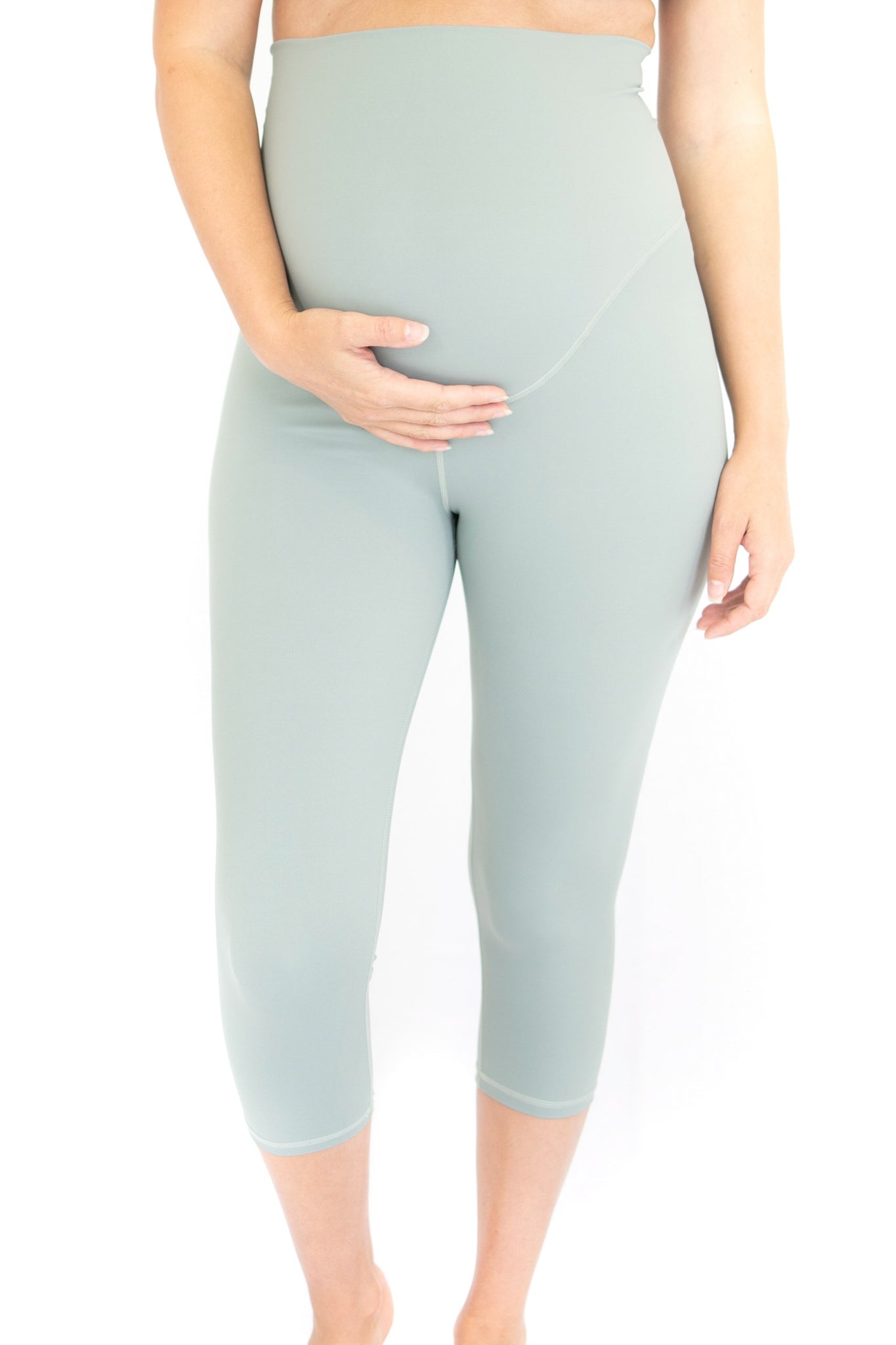 Pale green maternity leggings with high waistband for comfort during pregnancy