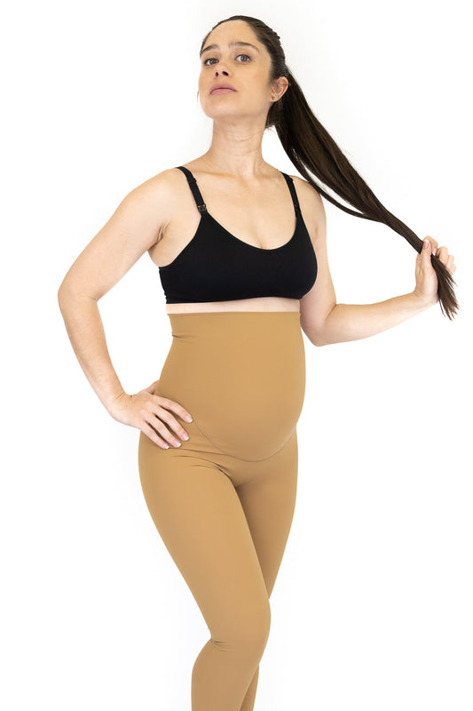 Woman in black sports bra and beige maternity leggings from FINAL SALE, limited sizes remaining