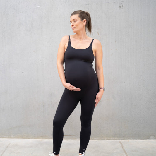 Pregnant woman in black workout outfit showcasing Juliette Nursing Maternity Bodysuit