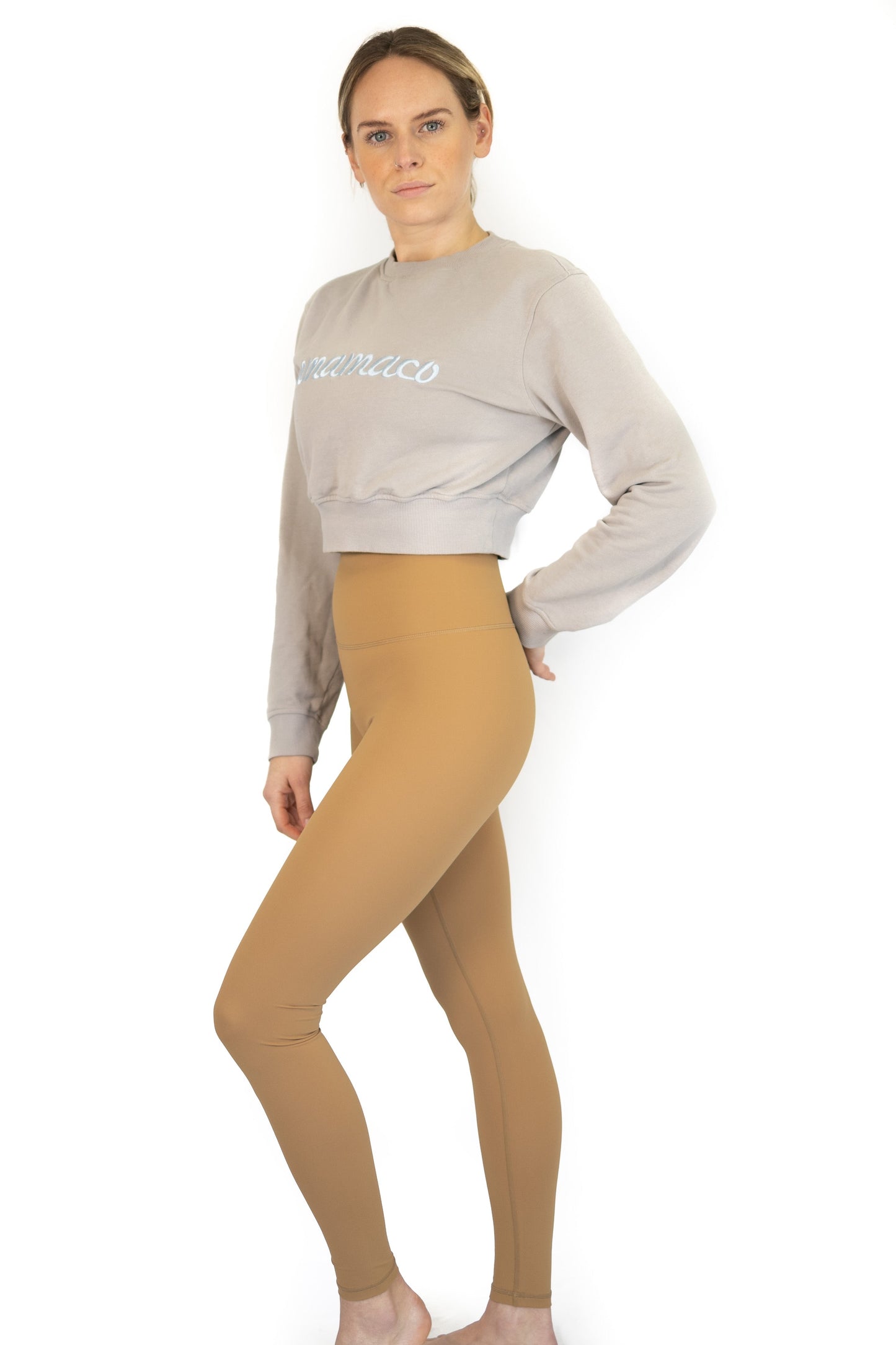 Woman in light gray cropped sweatshirt and tan leggings for Final Sale Shaper Move Leggings