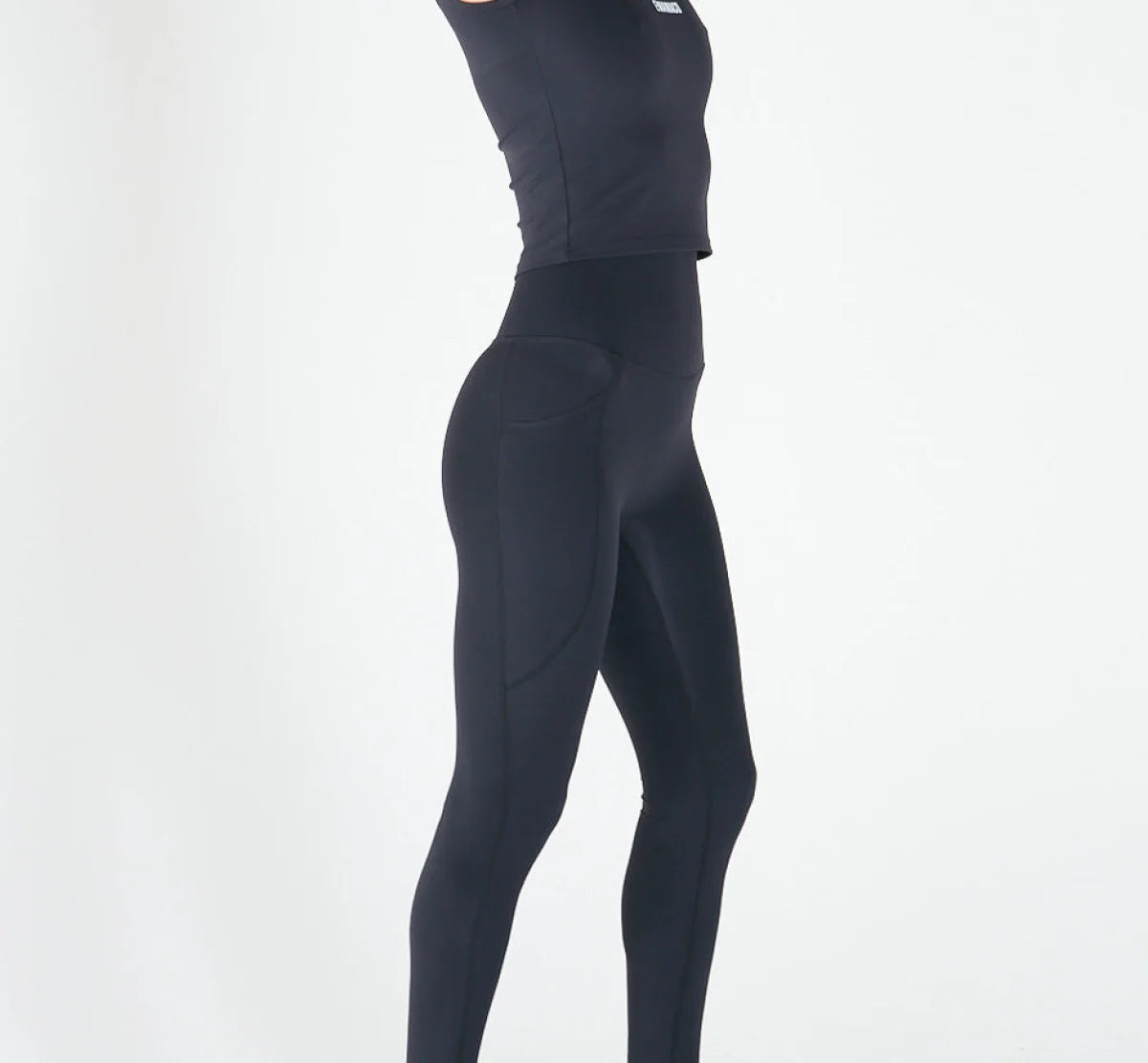 Black high-waisted athletic leggings for activewear with pockets and shapewear support