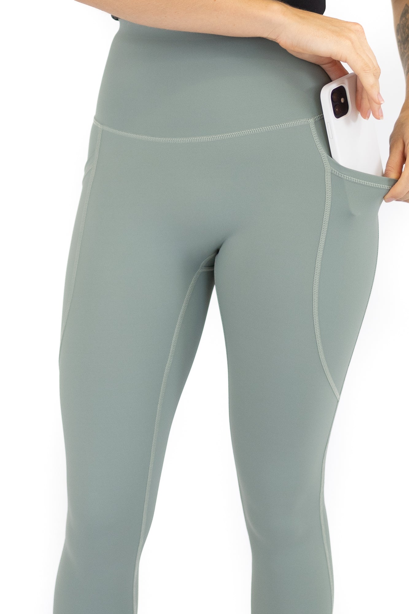 Pale green high-waisted Shaper Move Leggings with pockets on final sale, limited sizes available