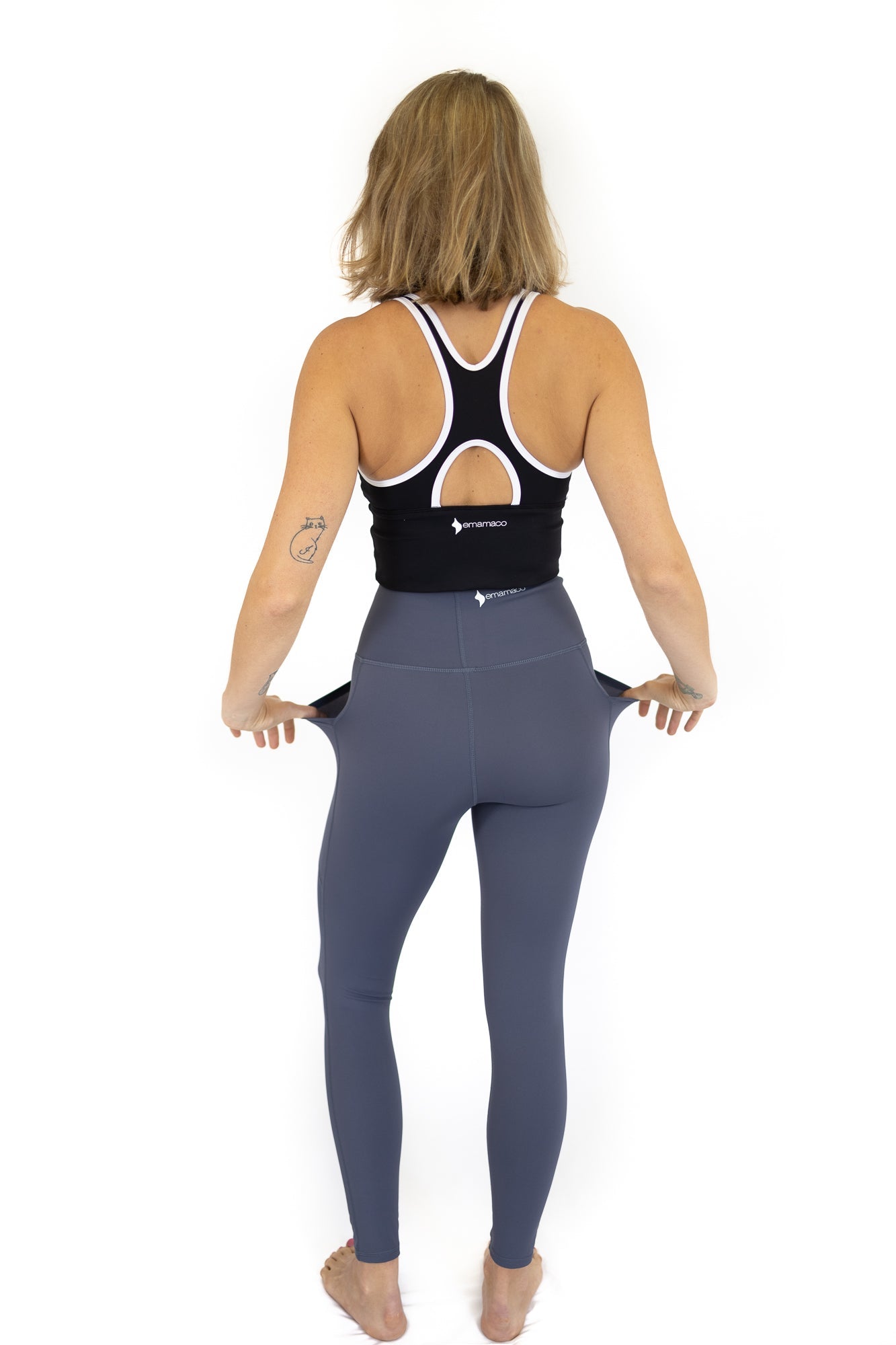 Woman in Shaper Move Leggings, a stylish maternity activewear choice from behind