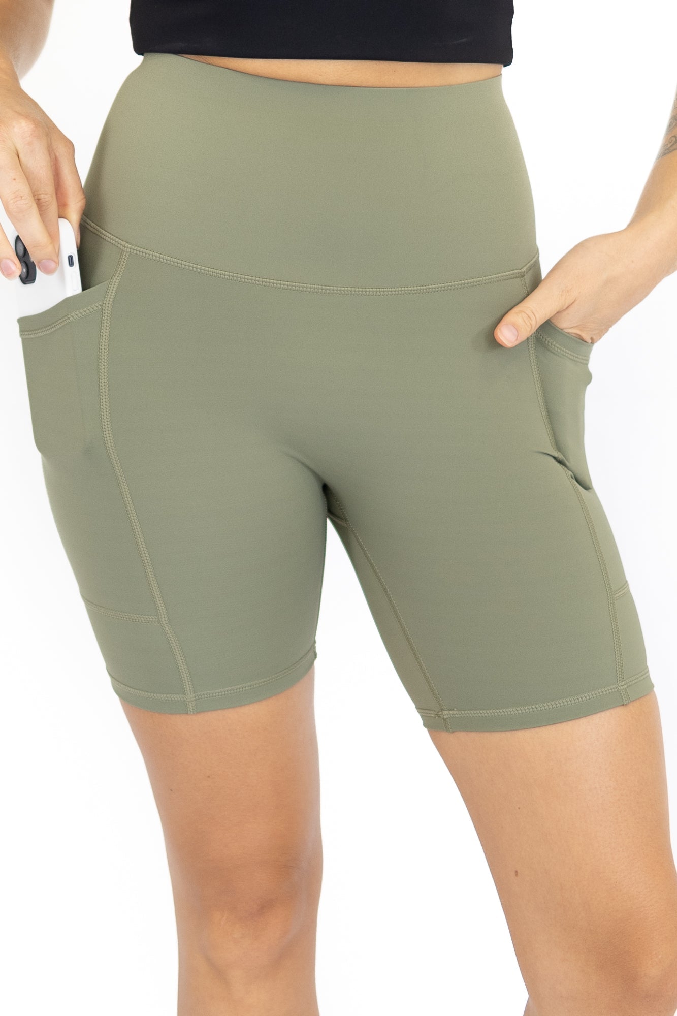 Sage green high-waisted workout shorts with pockets on final sale, limited sizes remaining