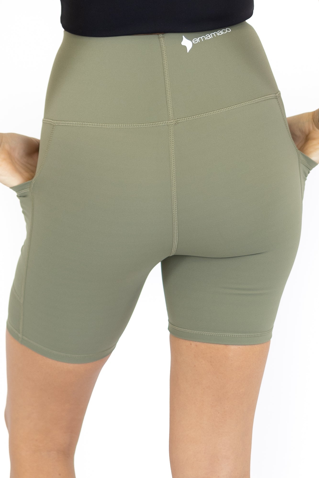 Olive green high-waisted workout shorts with pockets on final sale, limited sizes remaining