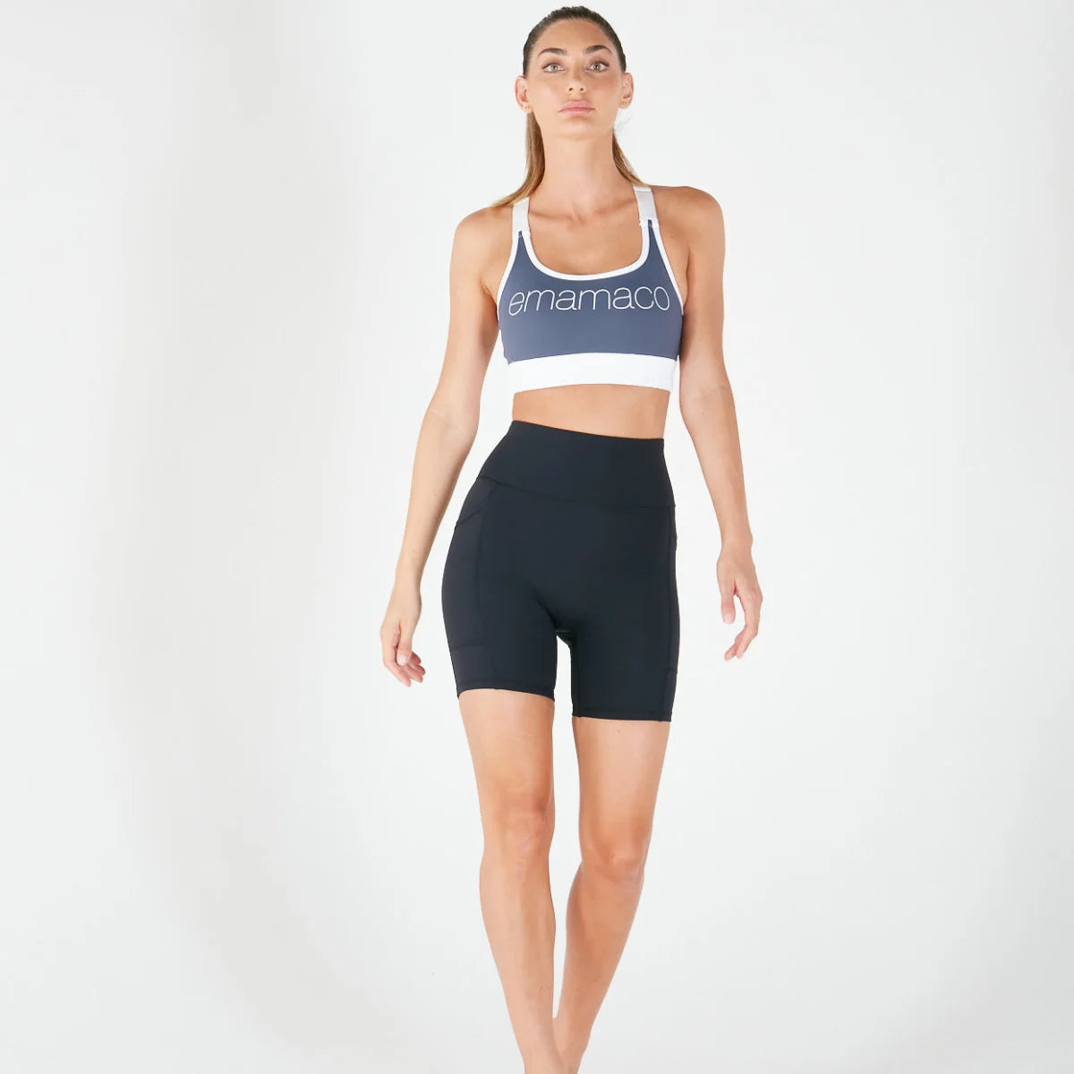 Woman in Vibe V Shorts with pockets, stylish v-back bike shorts for activewear